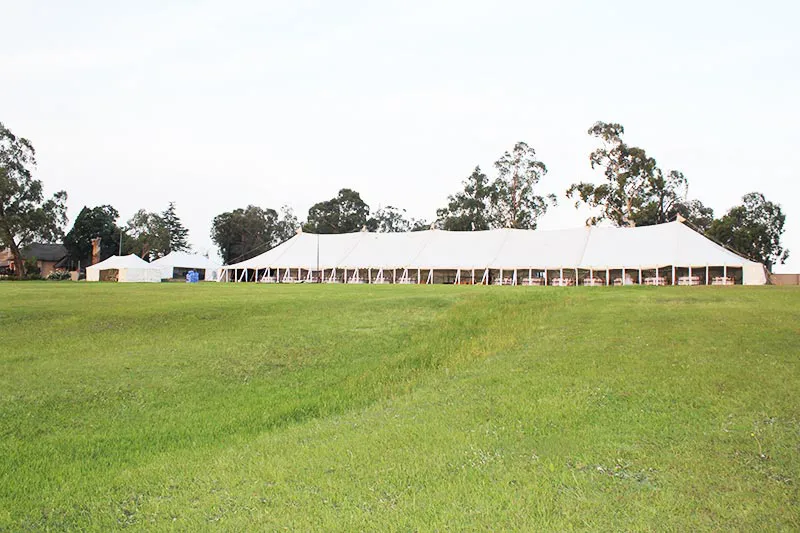 A long marquee on an open field